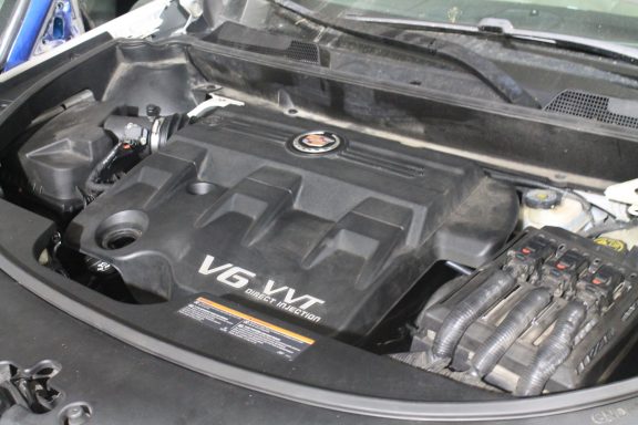 Cadillac engine in car with hood open